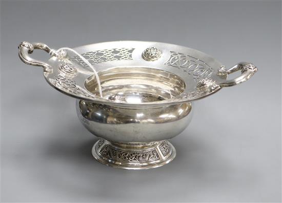 An Edwardian silver two handled presentation bowl, with Celtic decoration, Wakely & Wheeler, London, 1907, 8.5 oz.